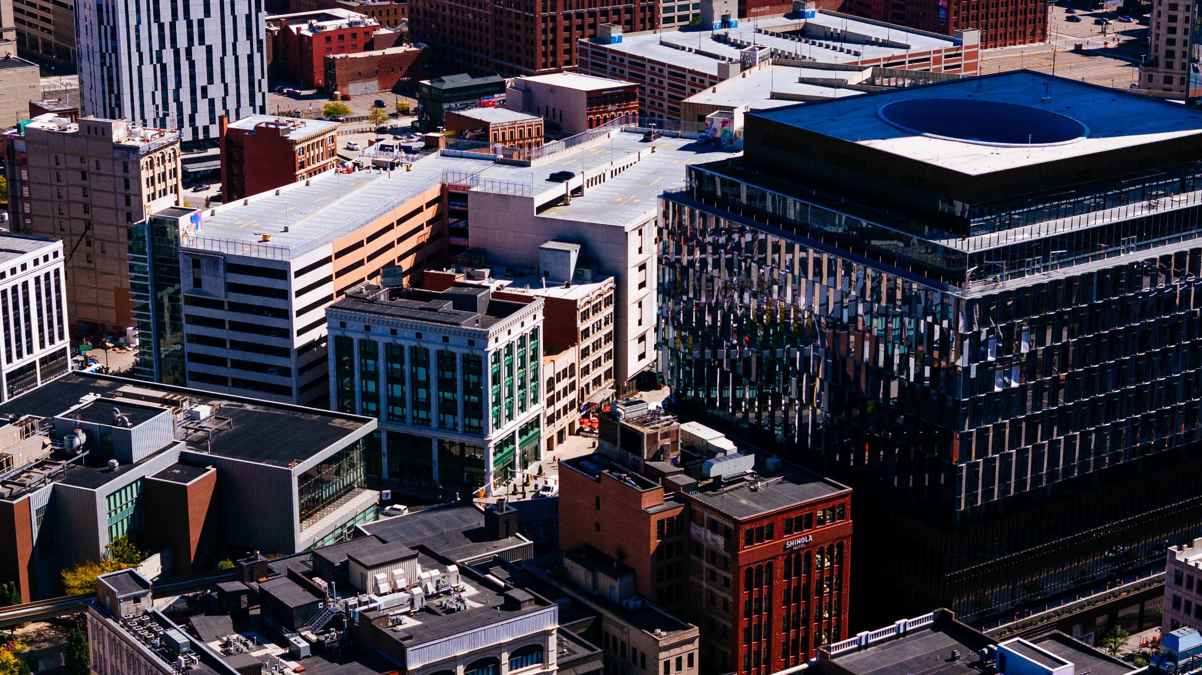 Aerial flyover of downtown Detroit closing in on 1250 Library St.